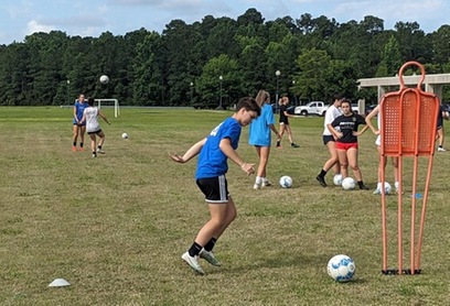 CFCC soccer camp participants playing soccer
